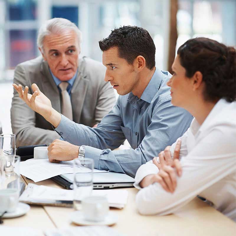 Waib3 Tech professionals discussing custom IT solutions with a client